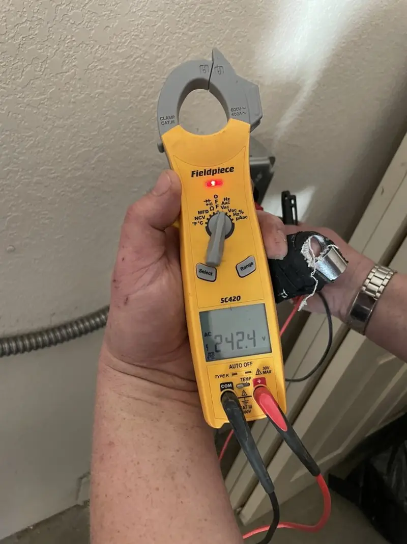 Voltage testing with clamp meter during Recessed Lighting Installation in Hampton